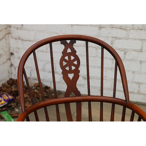 731 - 19th century wheelback Windsor chair, with elm seats, raised on turned supports, united by H-stretch... 