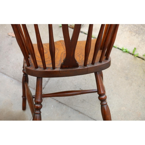 731 - 19th century wheelback Windsor chair, with elm seats, raised on turned supports, united by H-stretch... 