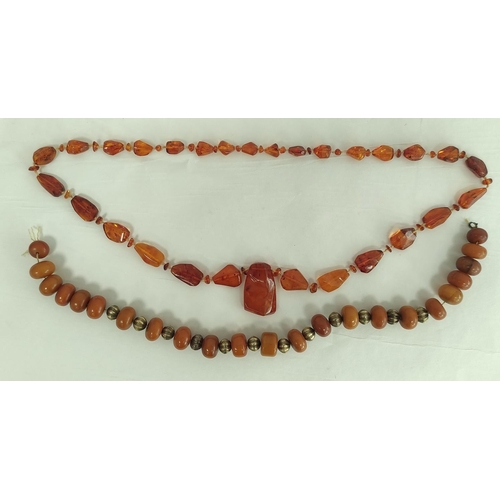 34 - Amber necklace of tablet links with drops, 85g and another.  (2)