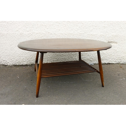 601D - Ercol dark elm top oval coffee table with turned supports united by spindle lower tier, 44cm high x ... 