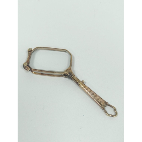 12 - 1920s continental gold lorgnette with rectangular lenses, unmarked, possibly14ct, 30g gross.