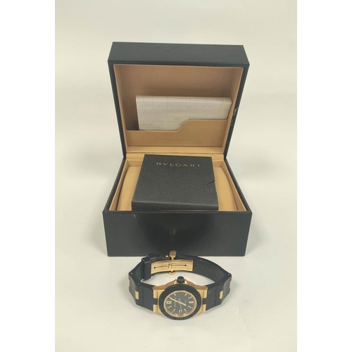 15 - Bulgari AL32 automatic watch, 18ct gold and butyl, with receipt and other items, in box.