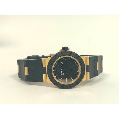 15 - Bulgari AL32 automatic watch, 18ct gold and butyl, with receipt and other items, in box.