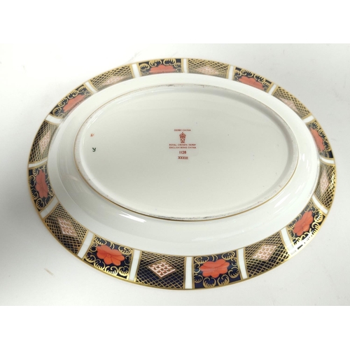 251 - Royal Crown Derby English bone china Imari shallow oval dish, No. 1128 with printed back stamp to un... 