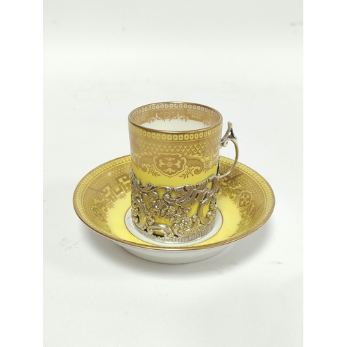 254 - Porcelain cabinet coffee cans with saucers to include an example by Cauldon with scroll silver liner... 