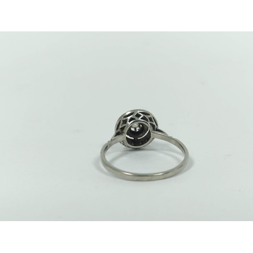 24 - Diamond solitaire ring with brilliant, within a circle of diamond points, and another in 9ct gold.  ... 