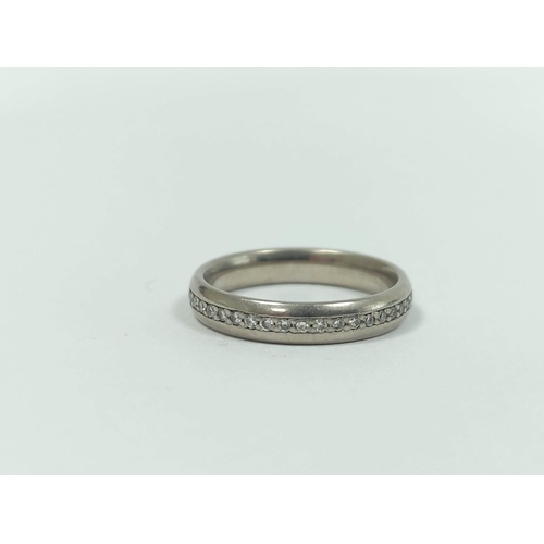 27 - Diamond half eternity style ring with a row of tiny diamond brilliants, in 18ct gold, size 'L½... 
