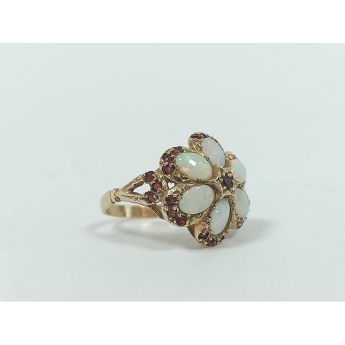 28 - Opal and garnet ring in 9ct gold, and another coral, 9ct gold, 6.8g.  (2)