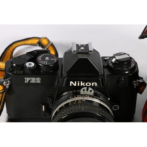 396 - Nikon FE2 35mm film camera fitted with Nikon Nikkor 50mm f=1:1.4 lens.