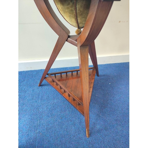 358 - Edwardian inlaid rosewood sewing table, the two section circular top opening to reveal a blue velour... 