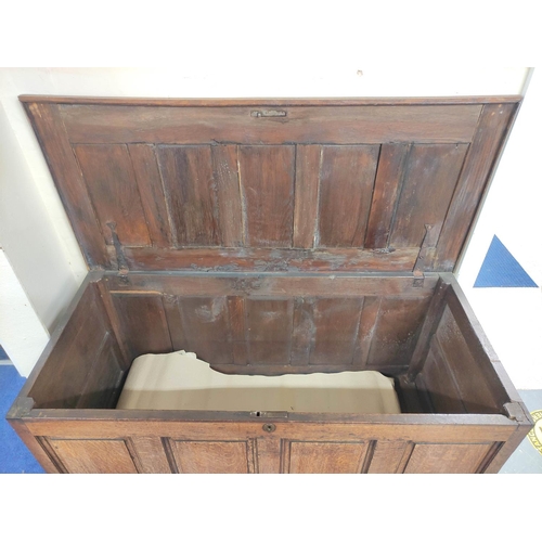 359 - Antique oak coffer with five panel hinged top, above four panel front, 75cm x 140cm x 63cm.