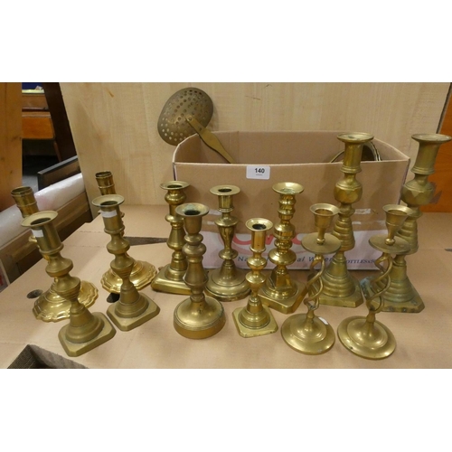 140 - Box of brass including candlesticks, trivet, etc.