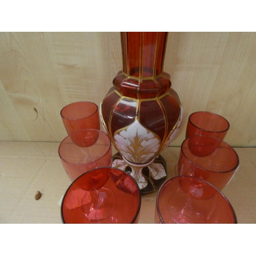 148 - Cranberry glass vase with enamel panels and six cranberry glass wine glasses.