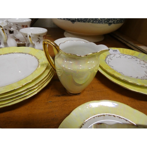 206 - Continental yellow and white ground tea set.