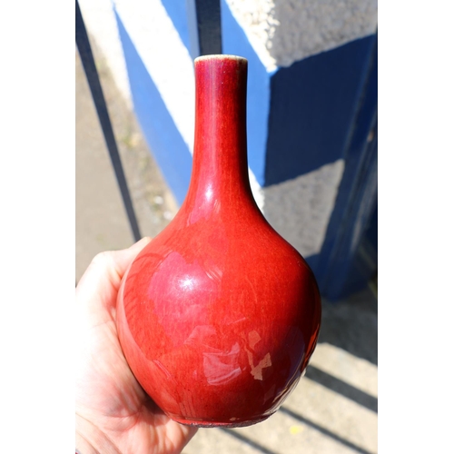 559 - Chinese flambe sang de boeuf blood red bottle vase, 21cm tall.