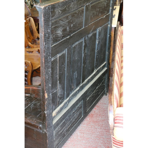 733 - 18th century settle, with panelled carved back, hinged seat over unfitted interior, 136 x 143 x 455c... 