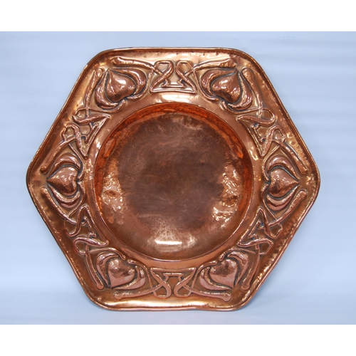 188 - Arts & Crafts copper octagonal wall charger, impressed to the border with stylised hearts and sc... 