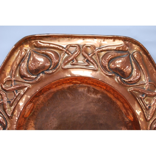 188 - Arts & Crafts copper octagonal wall charger, impressed to the border with stylised hearts and sc... 