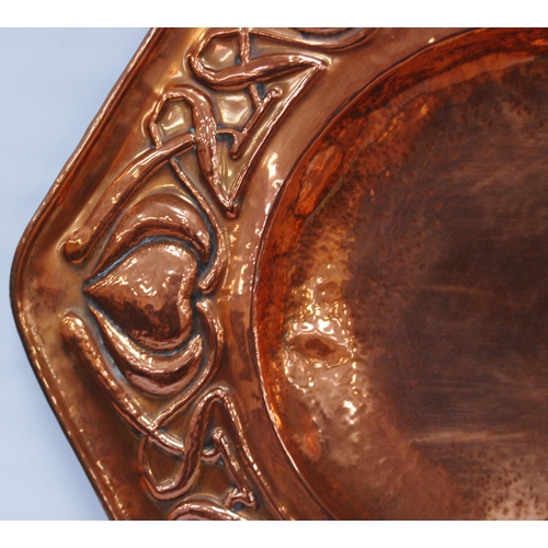 188 - Arts & Crafts copper octagonal wall charger, impressed to the border with stylised hearts and sc... 