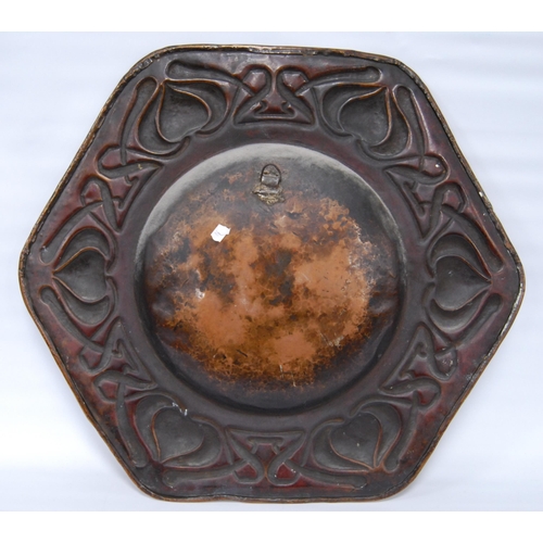 188 - Arts & Crafts copper octagonal wall charger, impressed to the border with stylised hearts and sc... 