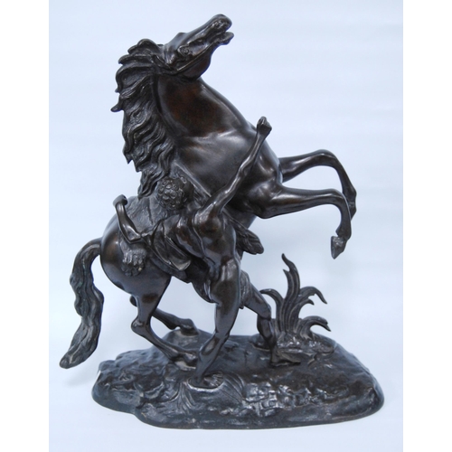 186 - In the Manner of Guillaume Coustou (French)Pair of bronze Marley horse and figure groups, modelled a... 