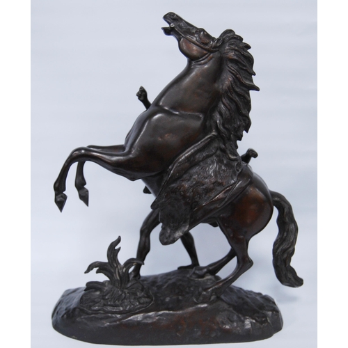 186 - In the Manner of Guillaume Coustou (French)Pair of bronze Marley horse and figure groups, modelled a... 