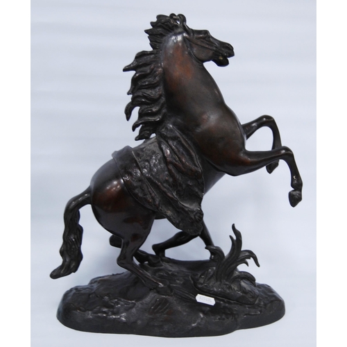 186 - In the Manner of Guillaume Coustou (French)Pair of bronze Marley horse and figure groups, modelled a... 