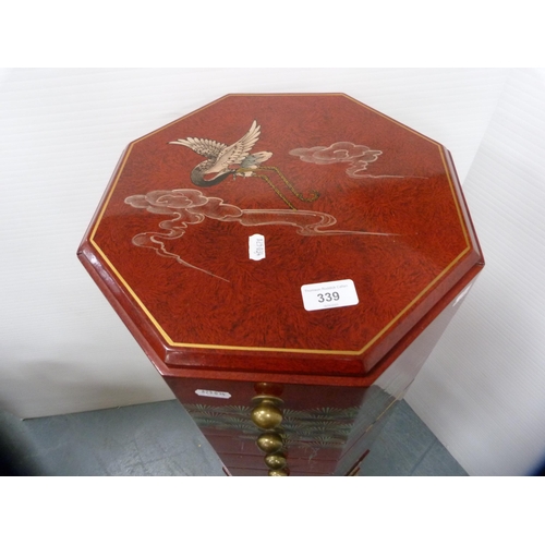 459 - Red lacquer octagonal chest of eight graduated drawers.