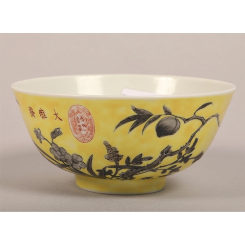 19 - An oriental yellow ground tea bowl decorated with flowers, four character mark to base, bowl 13cm d,... 