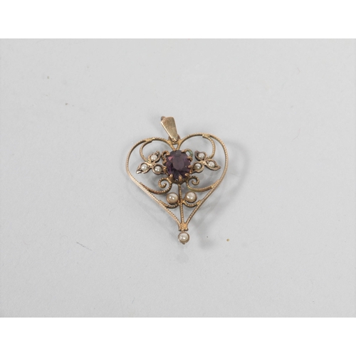 110 - Unmarked yellow metal Art Nouveau pendant set with Amethyst and seed pearls; 1.9g gross weight