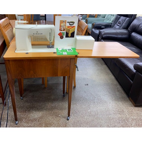 Singer sewing machine model no 6790 with table