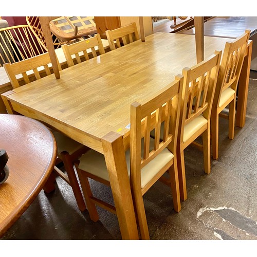 576 - Contemporary oak dining table with six chairs 