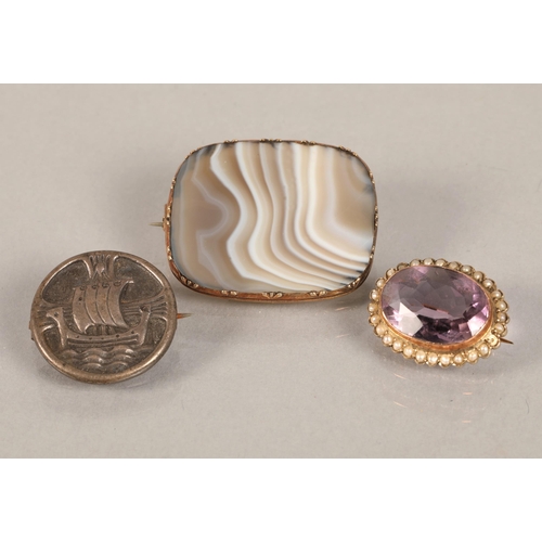 98 - Lot of three brooches, 9ct gold set amethyst and seed pearl, semiprecious stone, and white metal vik... 