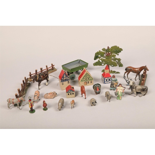 213 - A collection of children's toys including farm yard animals, trees, wooden houses, fences etc