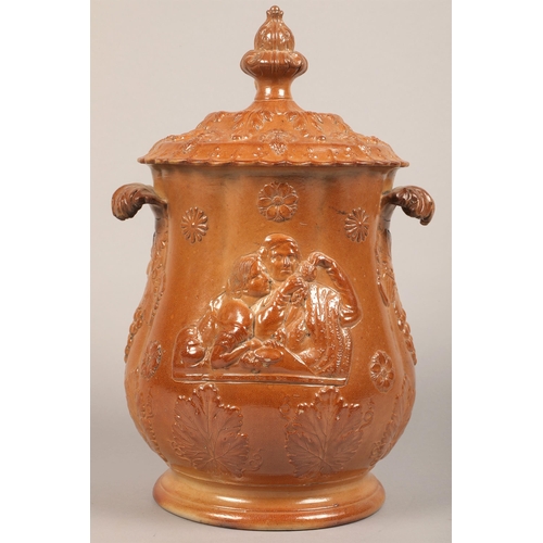 228 - Large Scottish salt glazed salt/wine crock with twin handles surmounted by figures, possibly Robert ... 