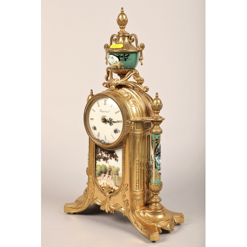 233 - Imperial gilt metal clock garniture decorated with panels of chateaus, one urn vase defective