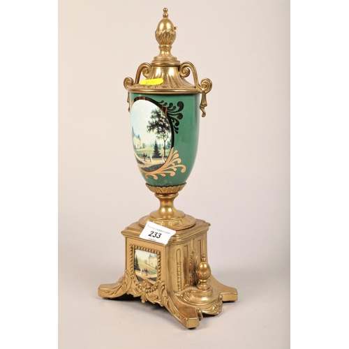 233 - Imperial gilt metal clock garniture decorated with panels of chateaus, one urn vase defective