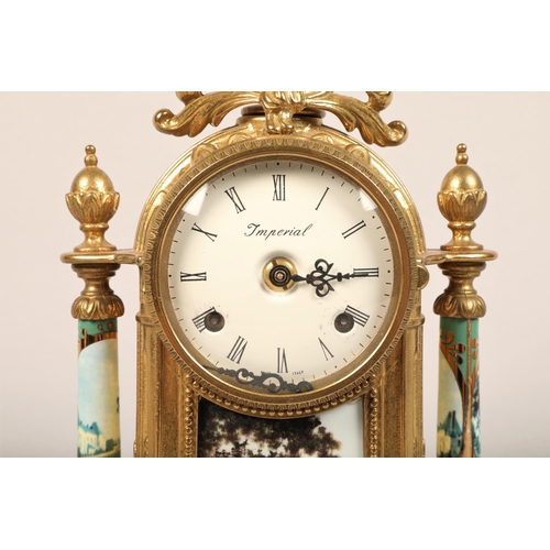 233 - Imperial gilt metal clock garniture decorated with panels of chateaus, one urn vase defective