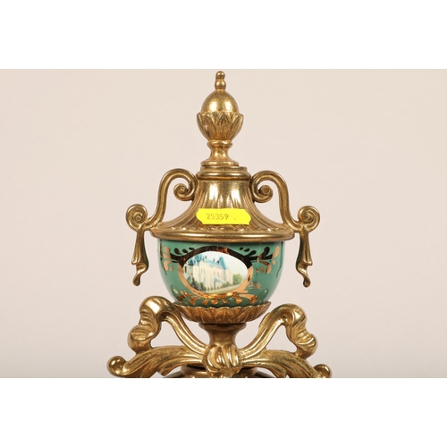 233 - Imperial gilt metal clock garniture decorated with panels of chateaus, one urn vase defective