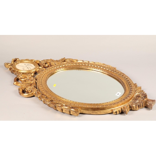 384 - Gilt oval mirror with oval cartouche of an early Victorian lady with bevel edge 109 x 59 cm 