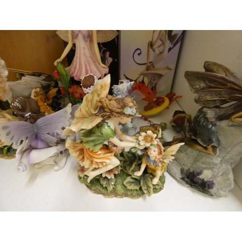 421 - Collection of resin Fairy ornaments including some boxed.