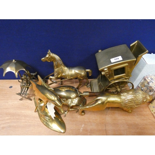 509 - Model brass horse and carriage, a brass lion and brass leaping dolphins etc