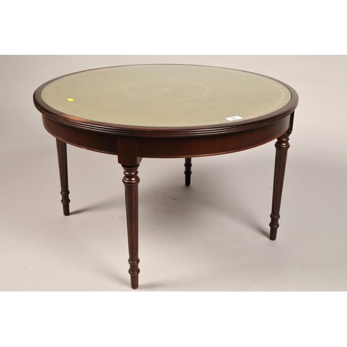 407 - Circular coffee table with leather embossed surface (74cm d, 45cm h)