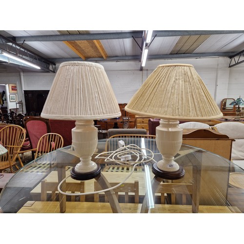 609 - Pair contemporary cream lamps with mismatched shades on wooden stands