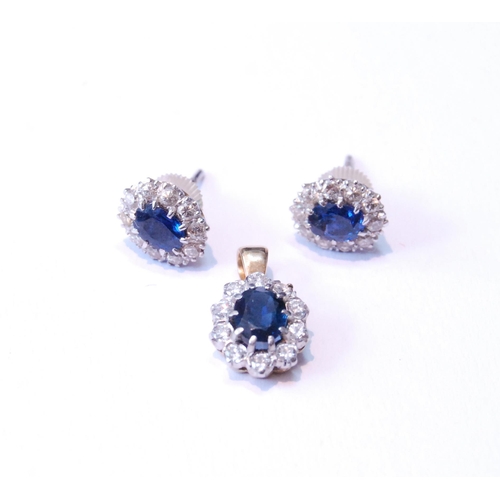 124 - Pair of sapphire and diamond cluster earrings, unmarked, probably white gold, with central oval-cut ... 