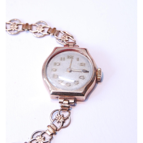 160 - Dennison 9ct gold-backed lady's wristwatch on a rolled gold pierced bracelet, and an Omega lady's wa... 