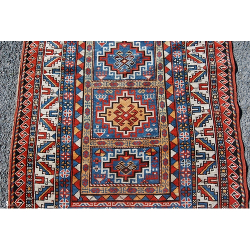 356 - Antique Turkish hand-knotted rug with four geometric medallions to the centre within all over geomet... 