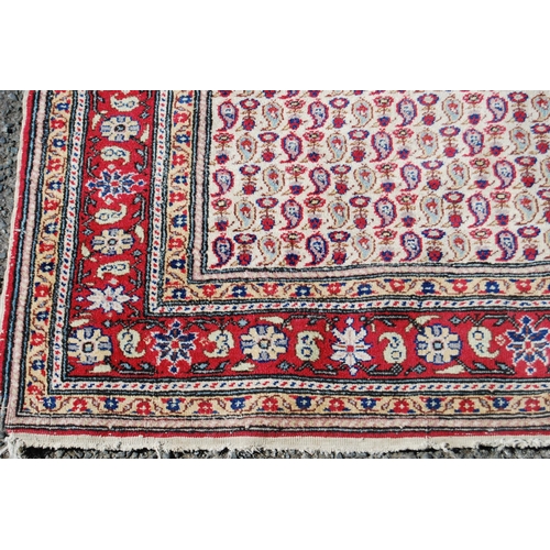 357 - Antique Turkish hand-knotted rug with all over floral and geometric motifs, on a red, blue and cream... 