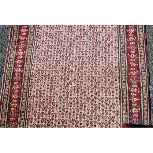 357 - Antique Turkish hand-knotted rug with all over floral and geometric motifs, on a red, blue and cream... 