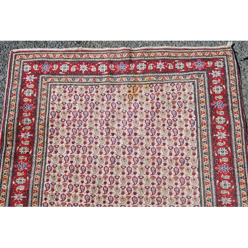 357 - Antique Turkish hand-knotted rug with all over floral and geometric motifs, on a red, blue and cream... 